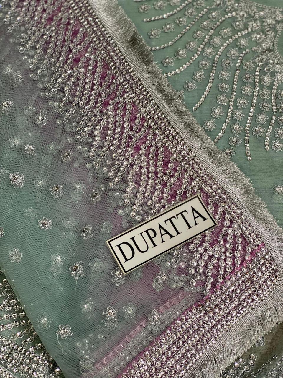 Decorative dupatta with embellishments and a visible label.