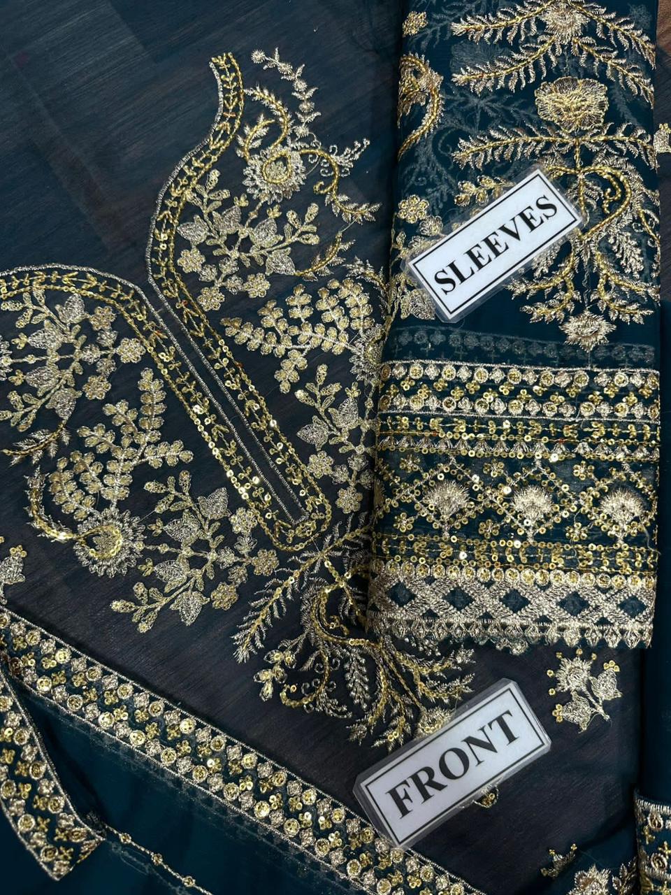 Embroidered fabric with gold patterns on a dark background, labeled 'Front' and 'Sleeves'.