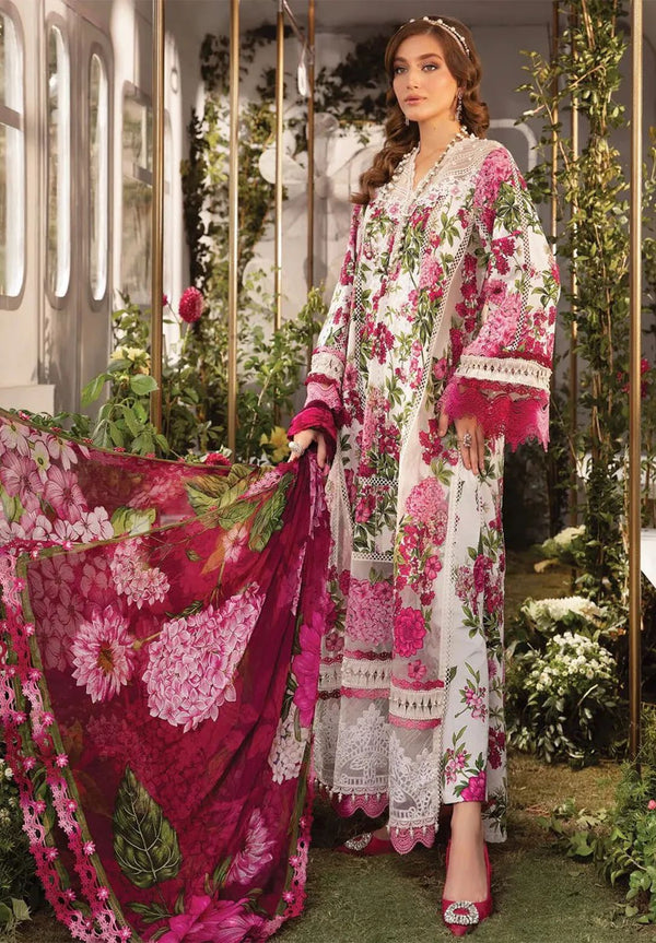Woman in a floral outfit with a pink dupatta in an outdoor setting