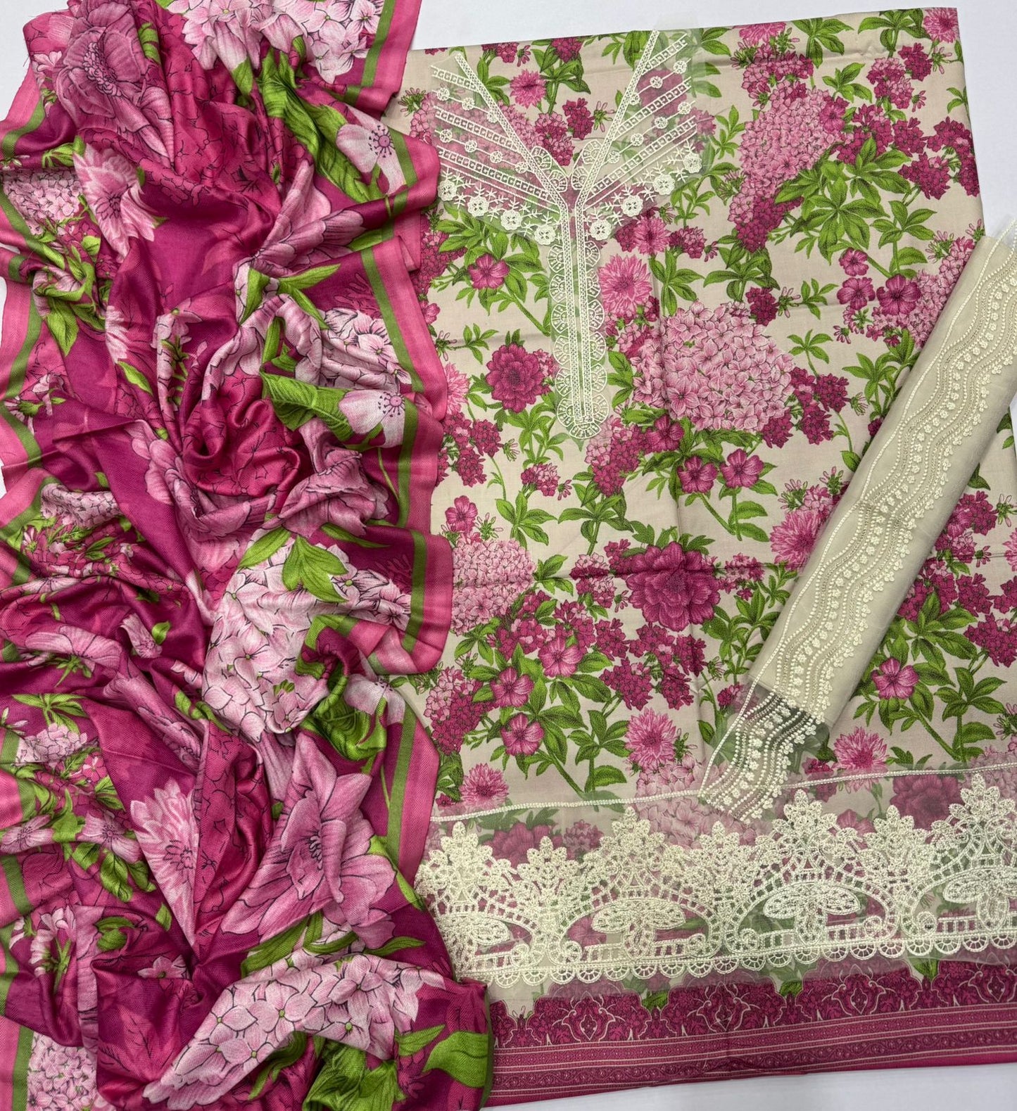 Floral fabric with pink and green patterns on a white background