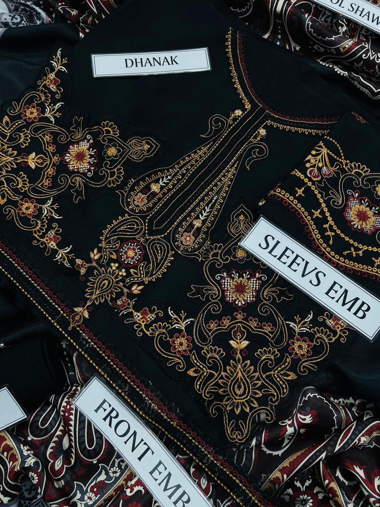 Embroidered fabric with labels indicating 'Dhanak', 'Sleeves Emb', and 'Front Emb'.