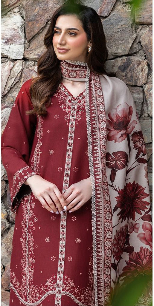 Woman wearing a maroon embroidered outfit with a floral dupatta, branded as Farasha.