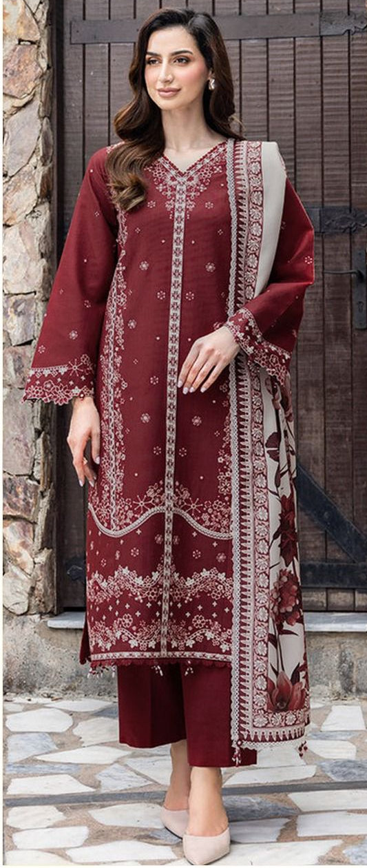 Woman wearing a maroon embroidered outfit with a floral dupatta, branded as Farasha.