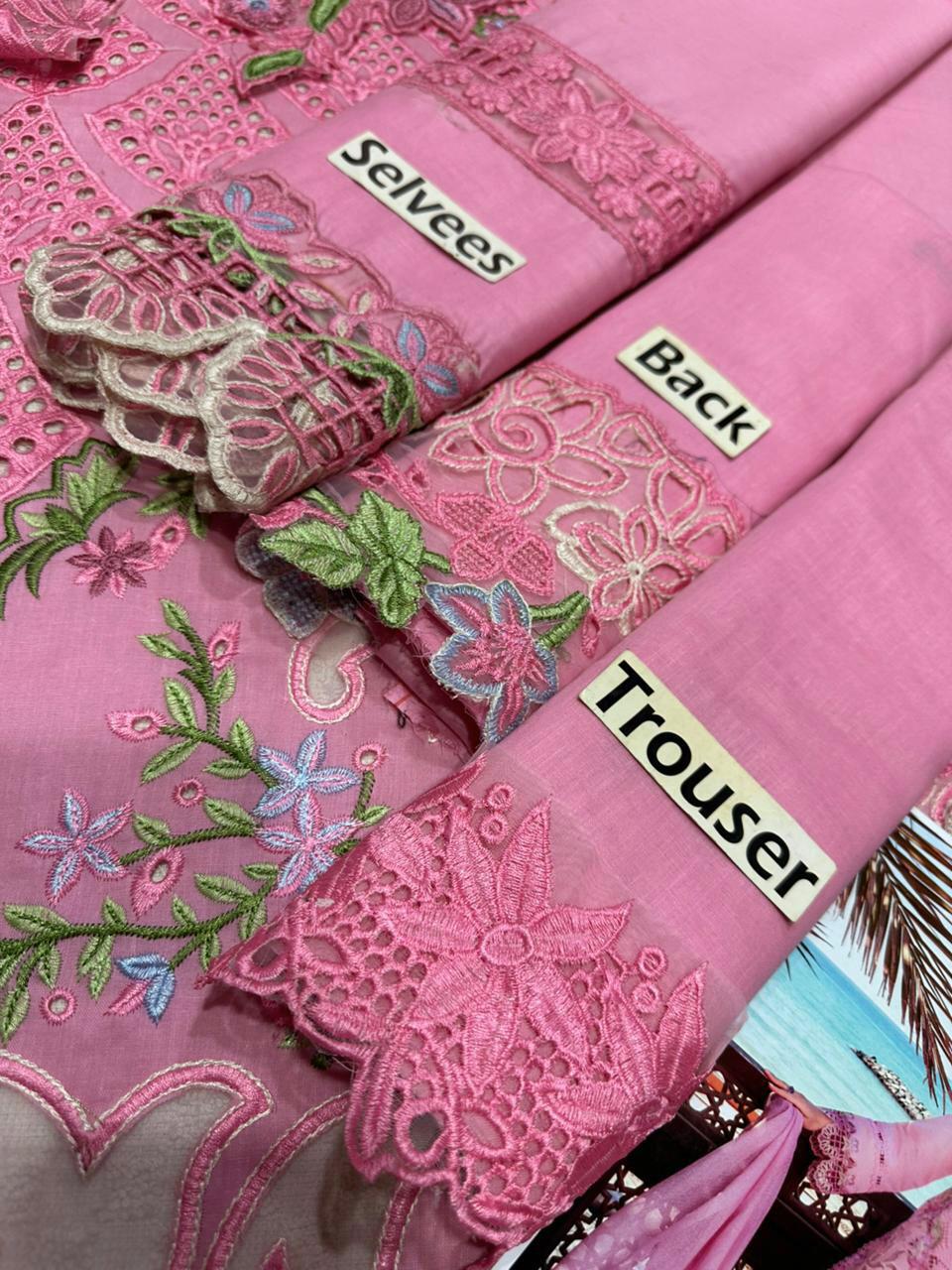 Pink fabric with intricate embroidery labeled 'Selvage', 'Back', and 'Trouser'.