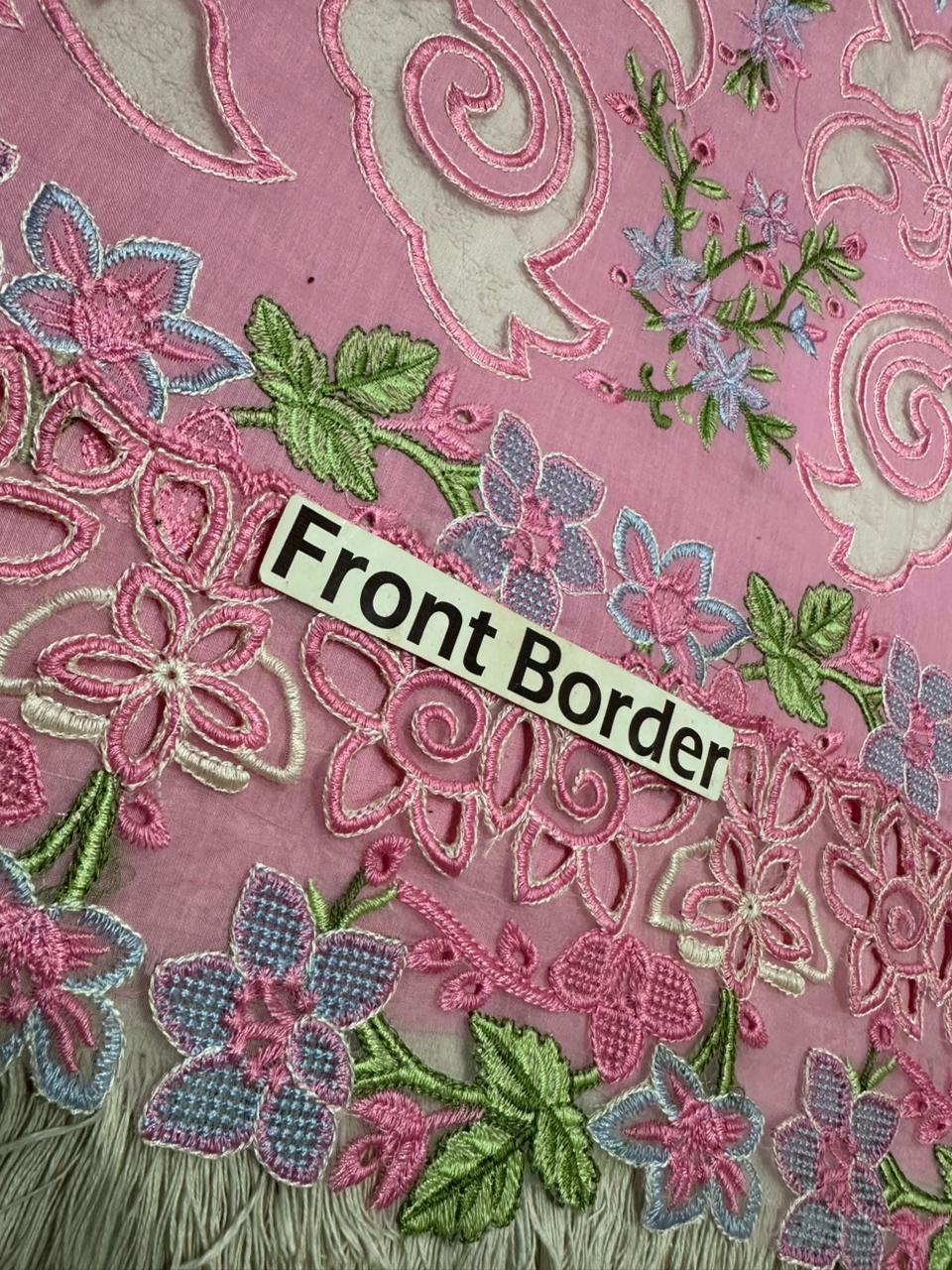 Close-up of embroidered fabric with floral patterns and a label indicating 'Front Border'.