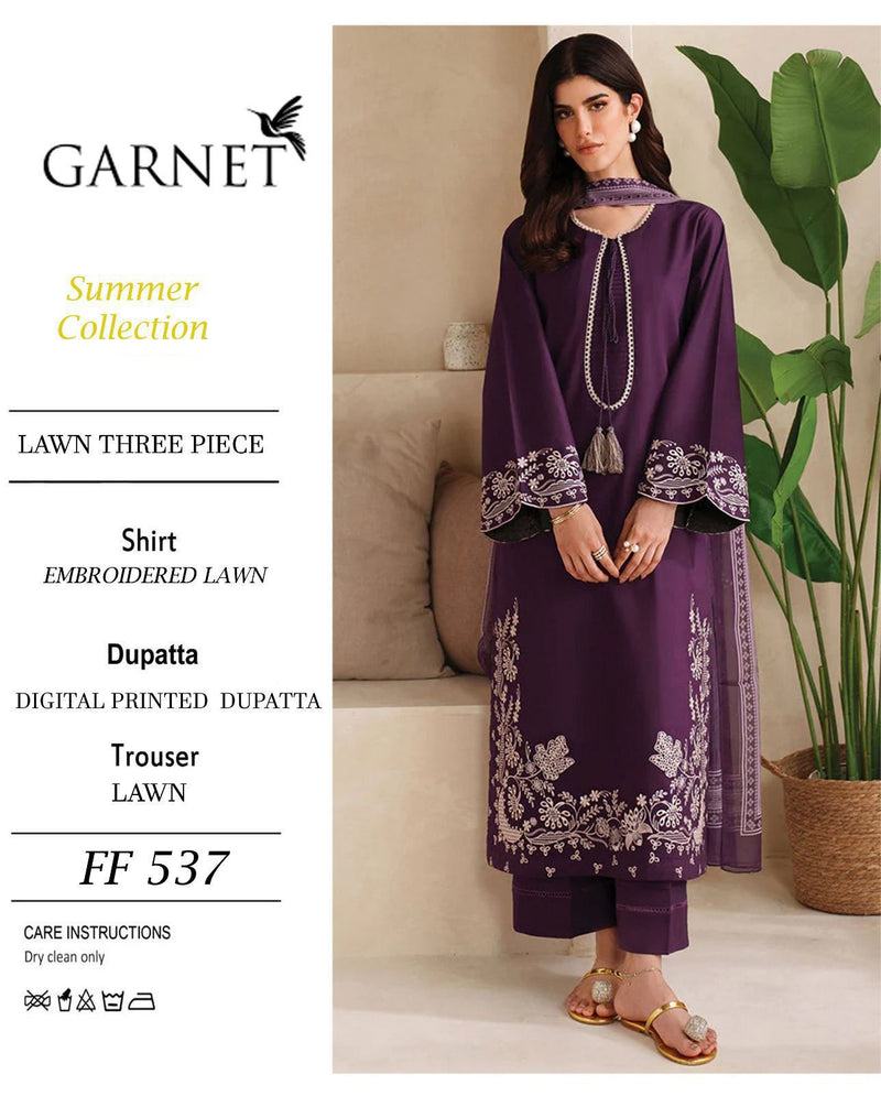 Purple embroidered outfit with 'Garnet' branding on a lifestyle background