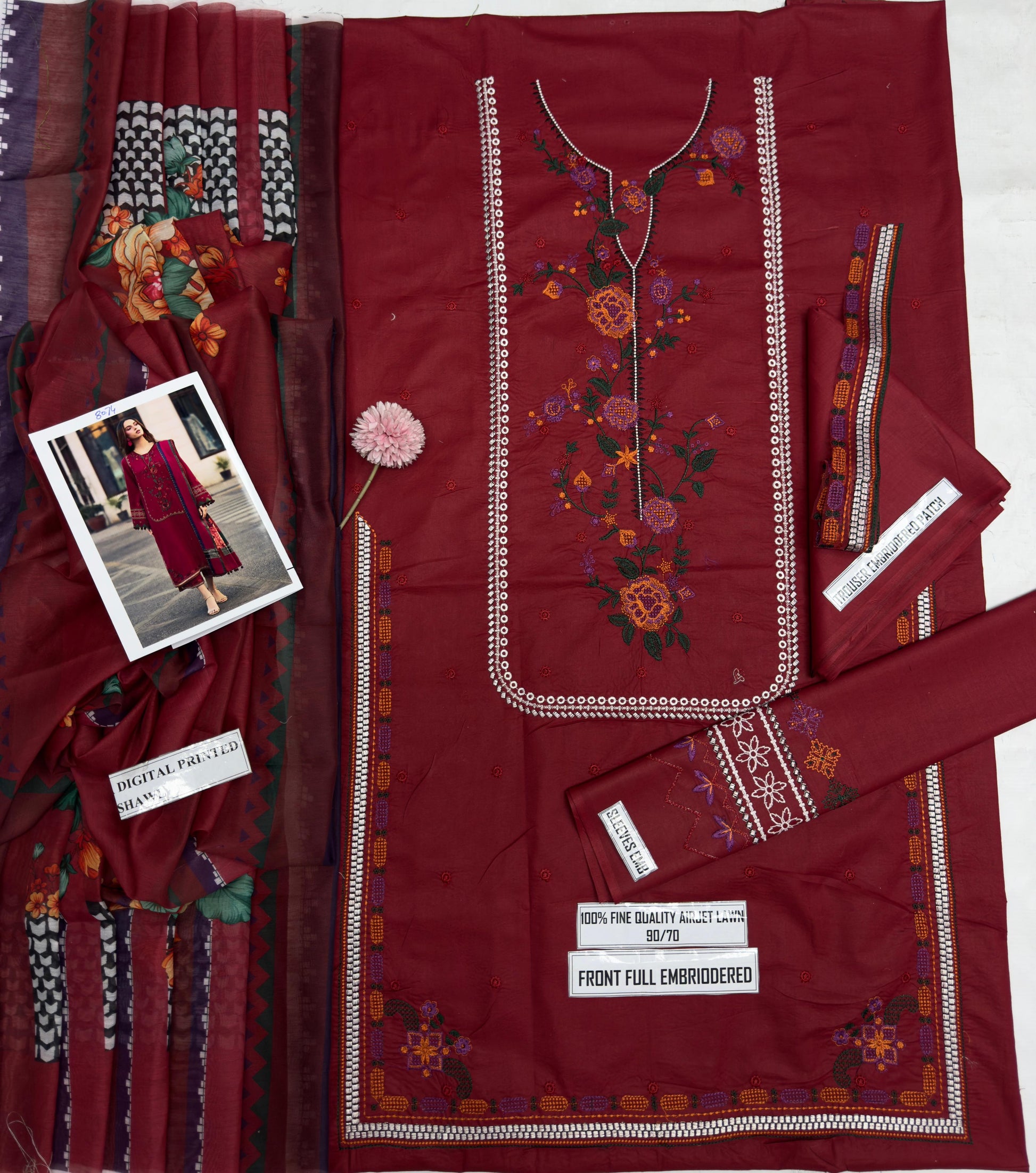 Red embroidered fabric with a model photo and labels on a white background