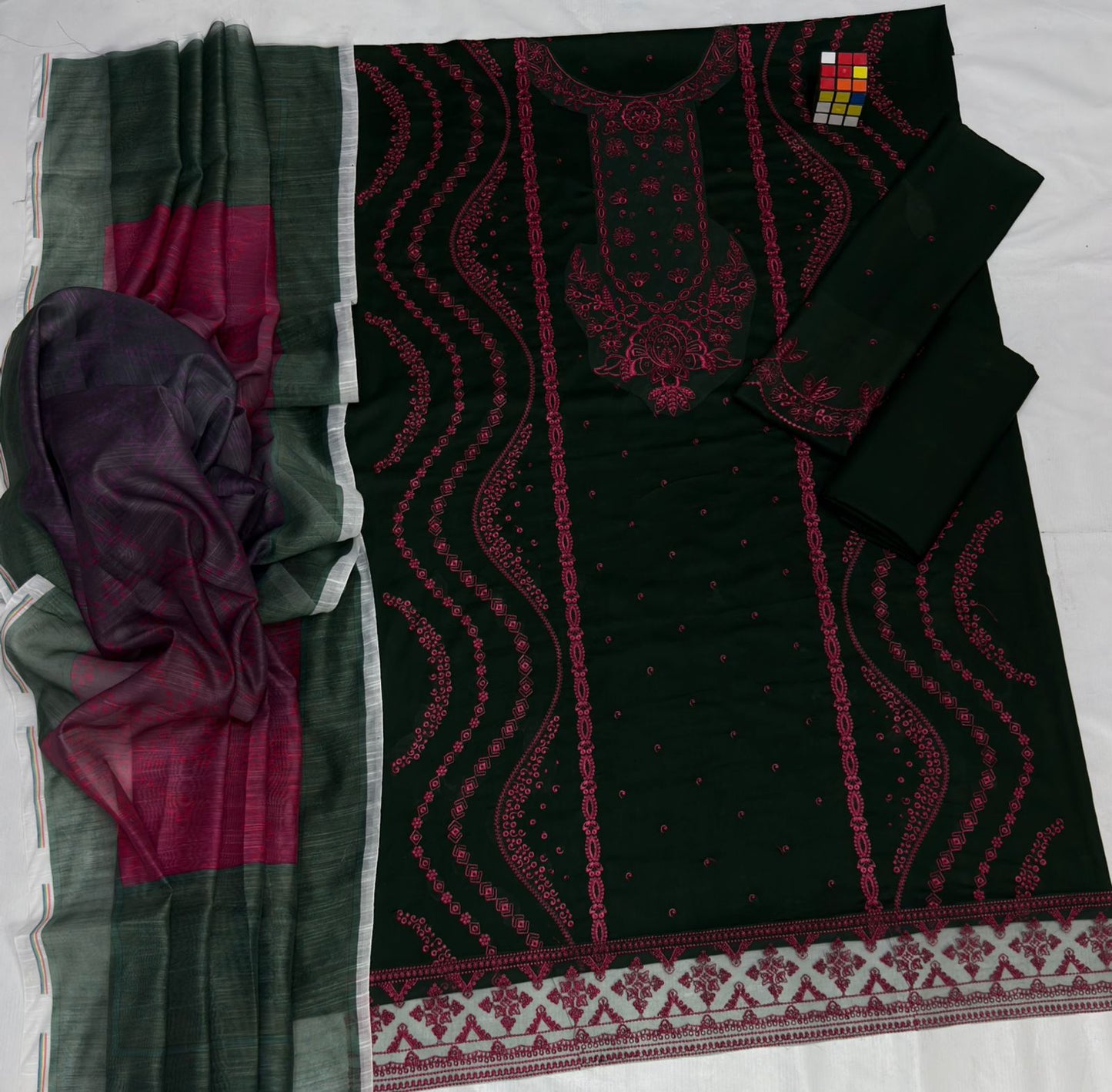 Two pieces of fabric with intricate patterns on a white background