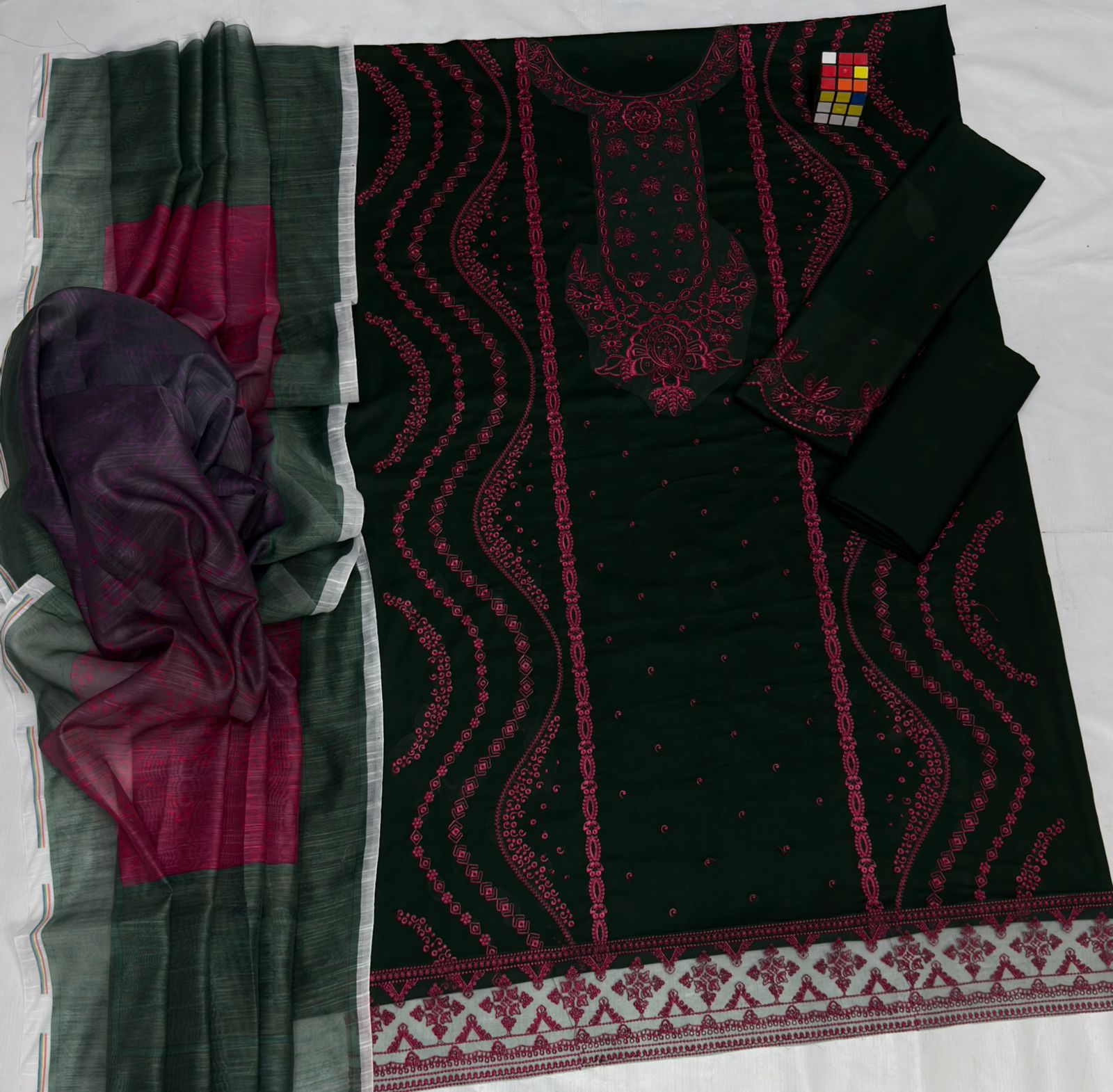 Two pieces of fabric with intricate patterns on a white background