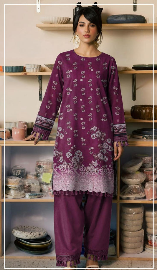 Woman wearing a purple embroidered shirt and pants in a kitchen setting, with 'Ripple Collection' branding.