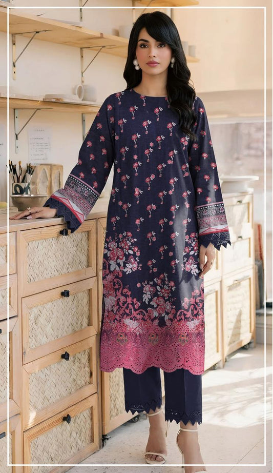 Woman wearing a navy blue and pink embroidered outfit with 'Ripple Collection' branding.
