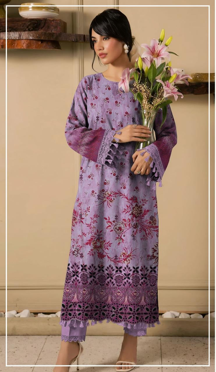 Woman wearing a purple embroidered shirt and trousers from Ripple Collection, holding flowers.
