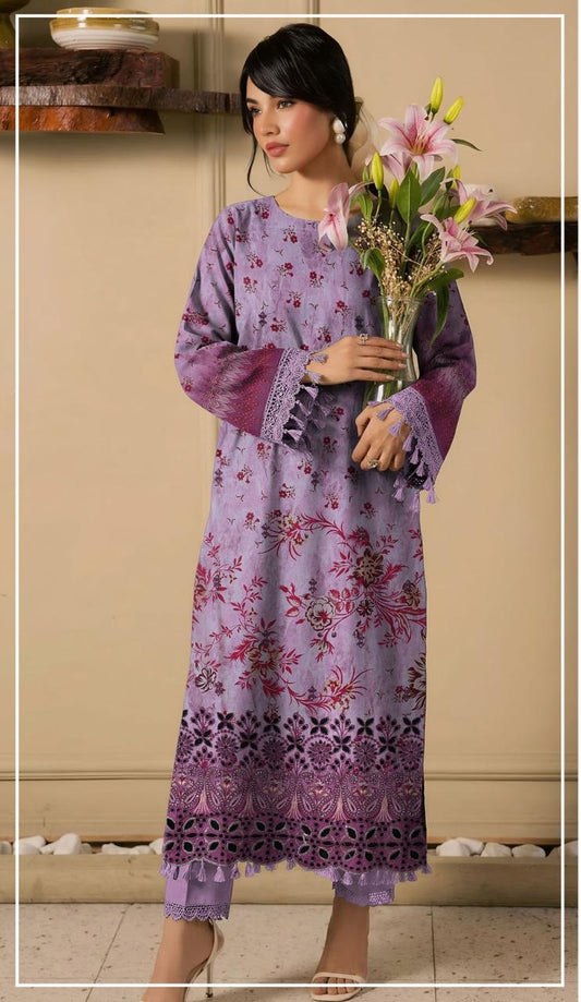 Woman wearing a purple embroidered shirt and trousers from Ripple Collection, holding flowers.
