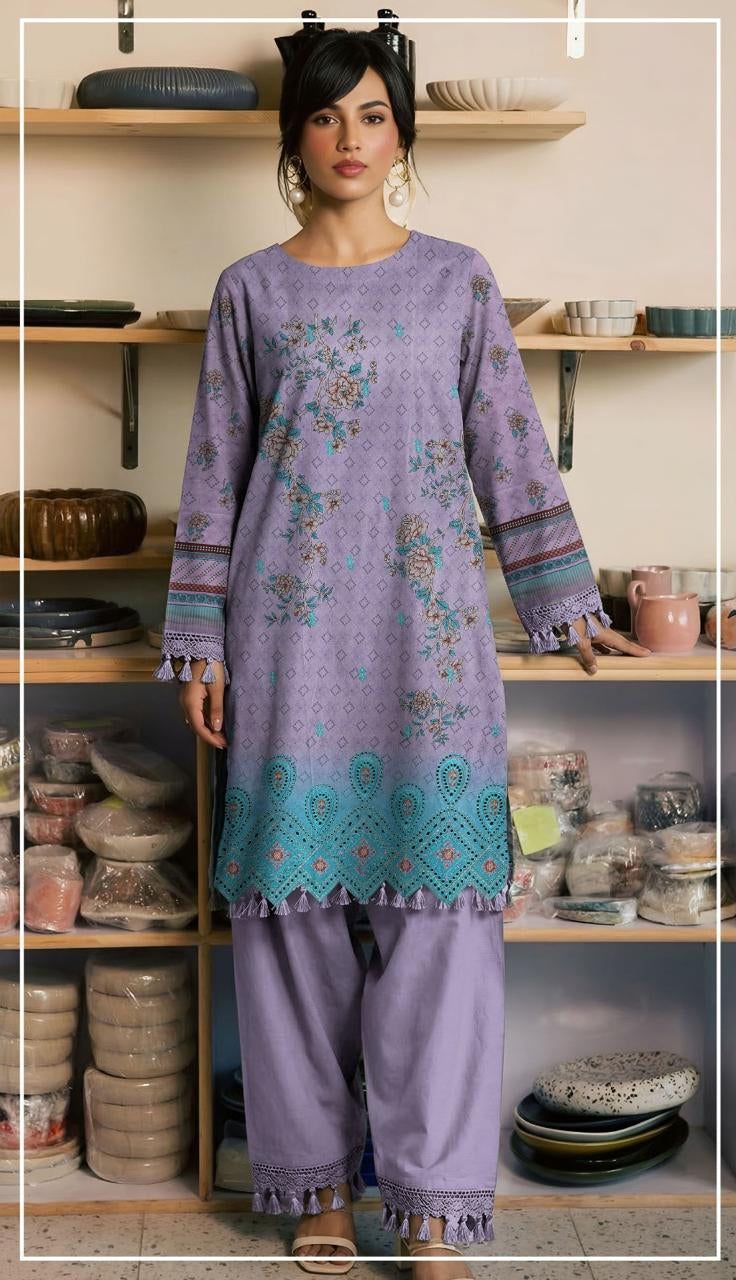 Woman wearing a purple embroidered shirt and pants with a Ripple Collection label.