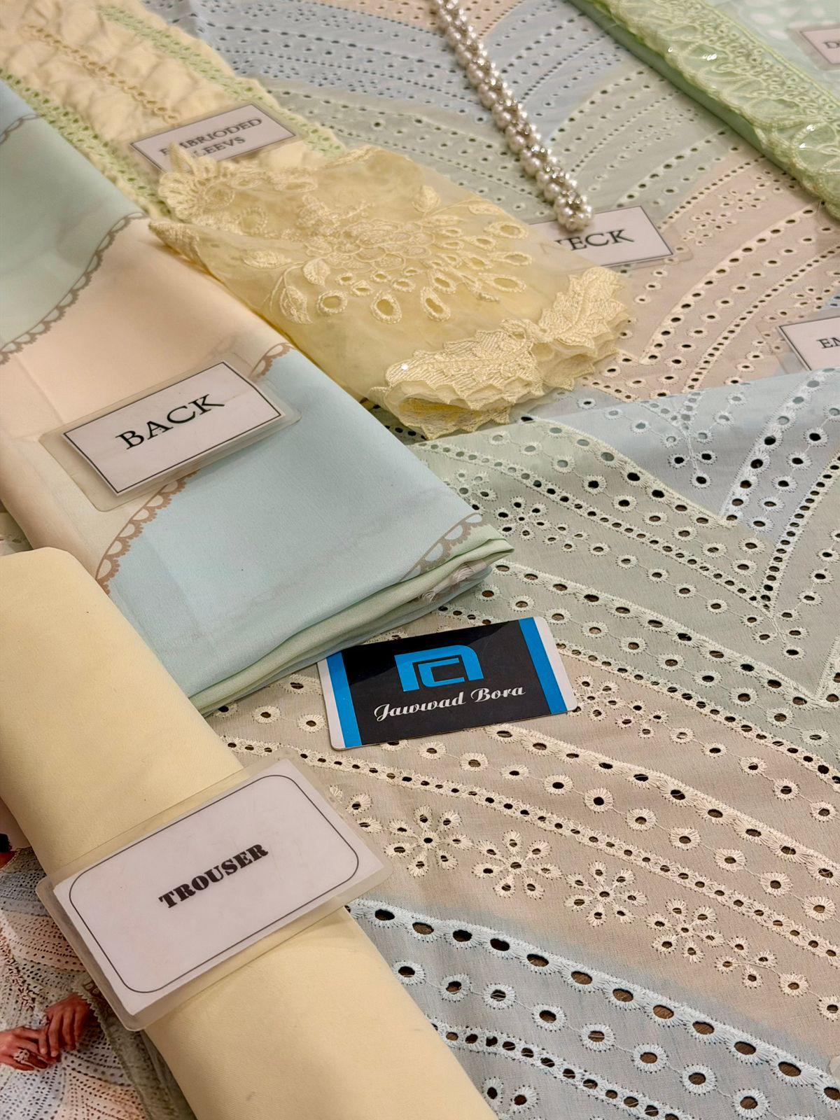 Collection of fabric swatches with labels indicating type and brand.